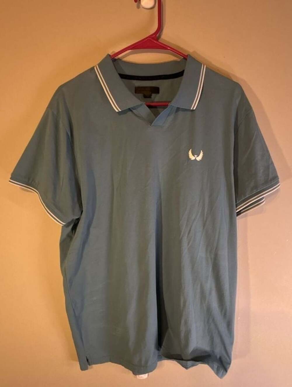 Nick Danger Blue Short Sleeve Polo Shirt with White Trim and Wing Logo